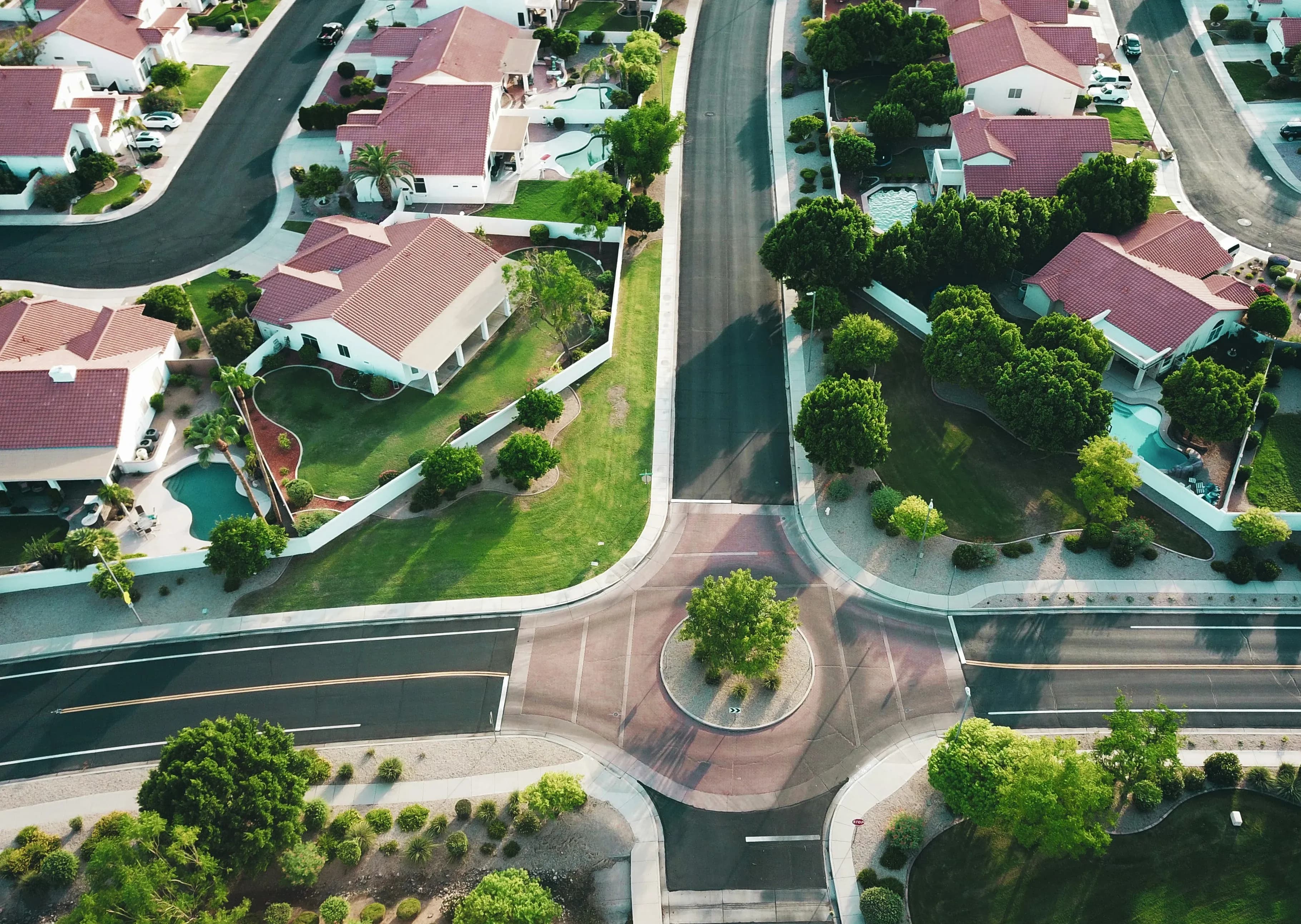 A neighborhood of suburban homes are visible from above thanks to drone photography.