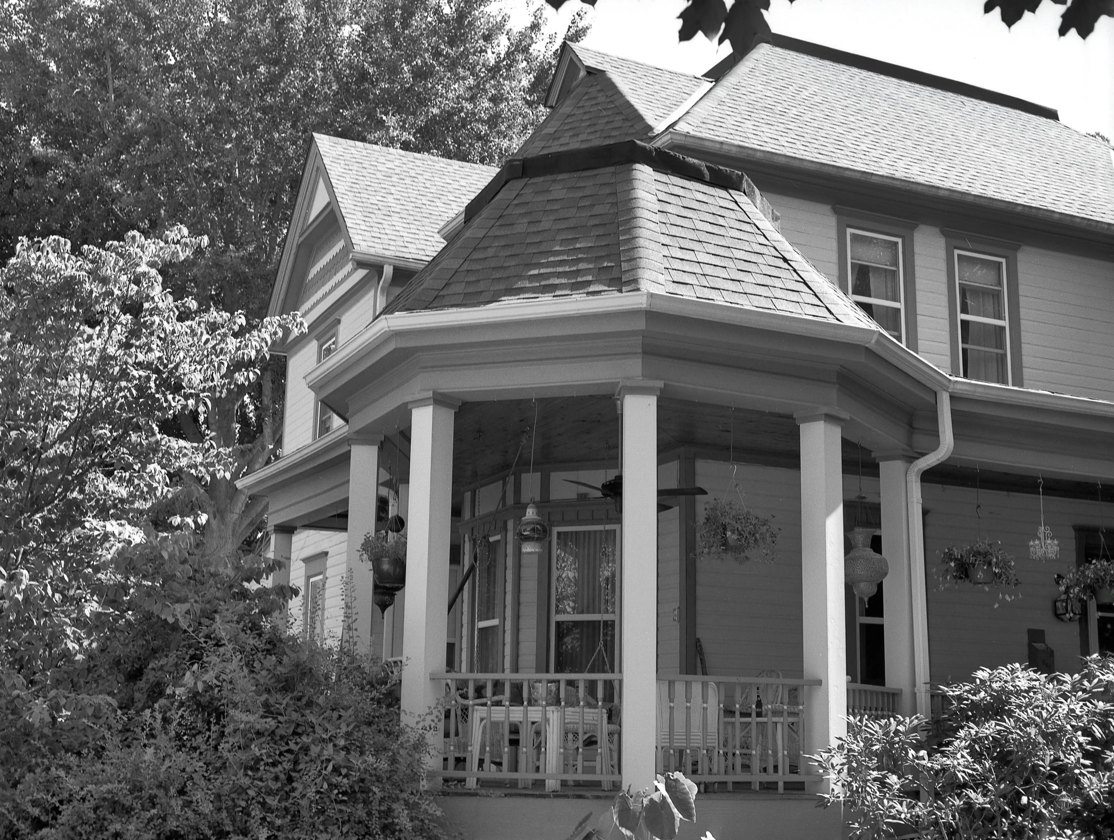 A two-story home in Missouri with an asphalt shingled roof.