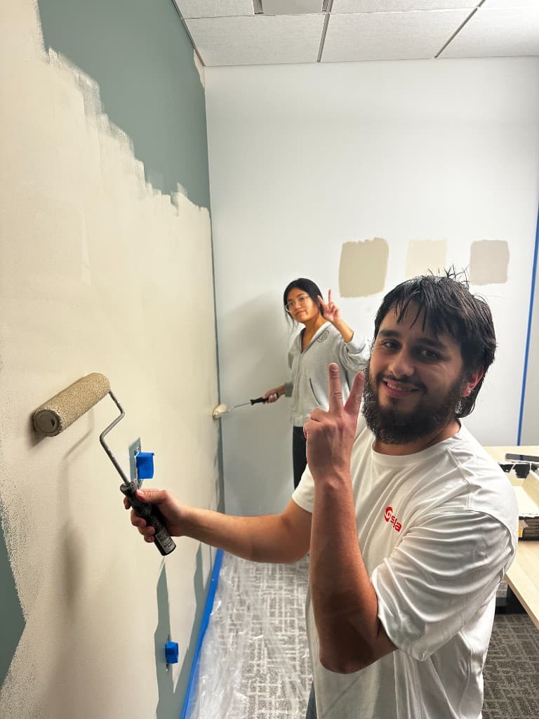 Sola teammates working together in a booth at the Atlanta office