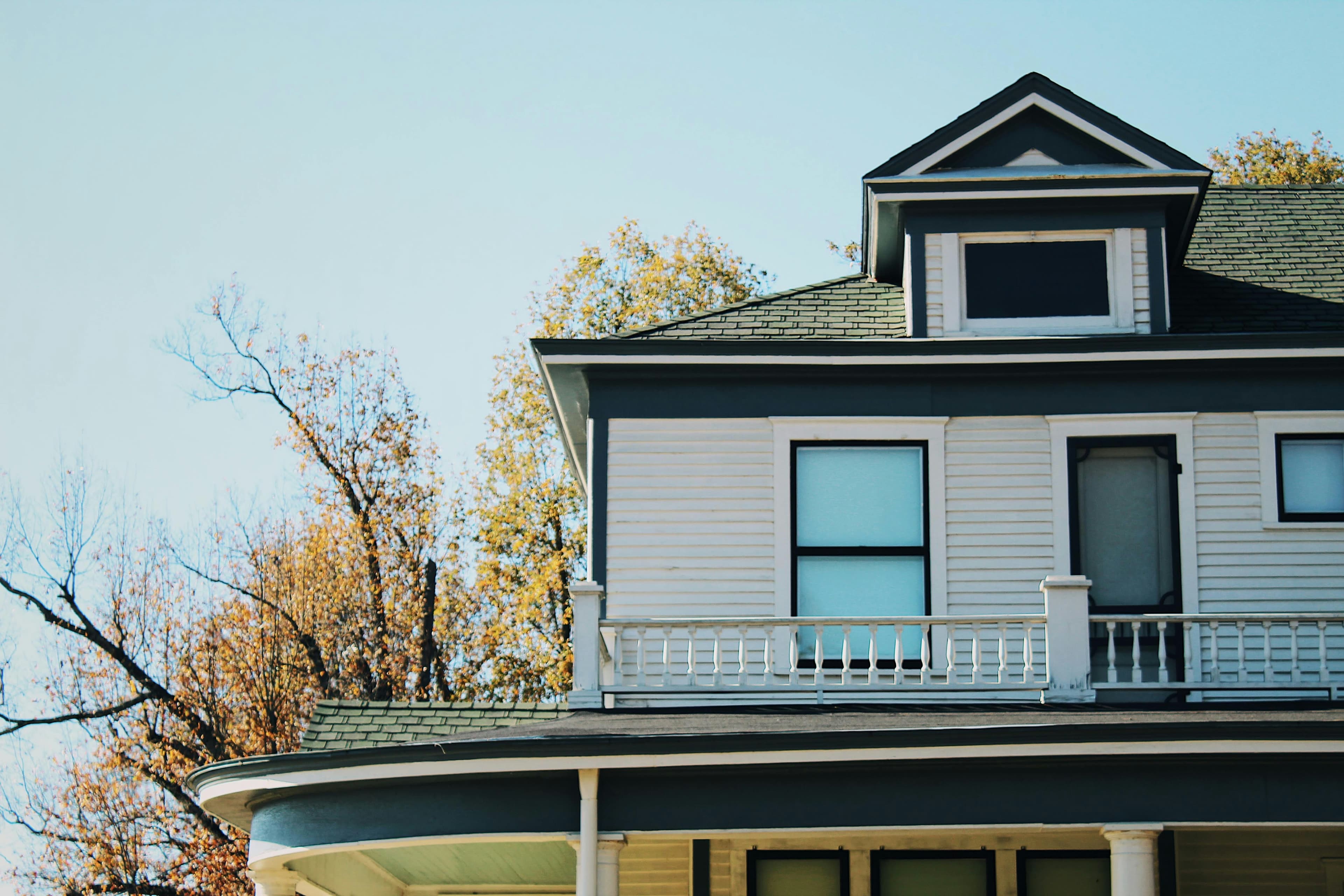 A two-story home in Arkansas, surrounded by mostly bare trees.