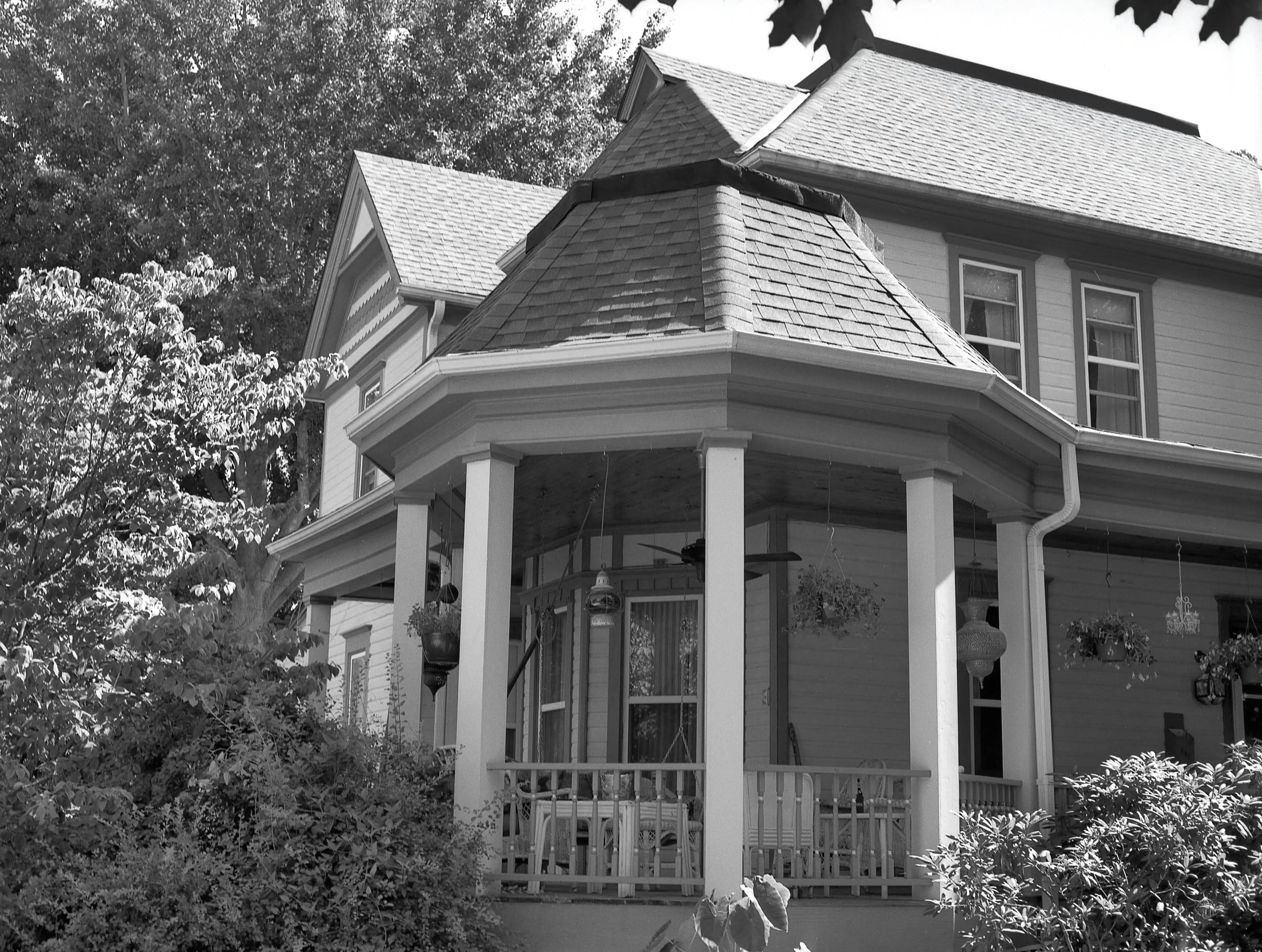 A two-story home in Missouri with an asphalt shingled roof.